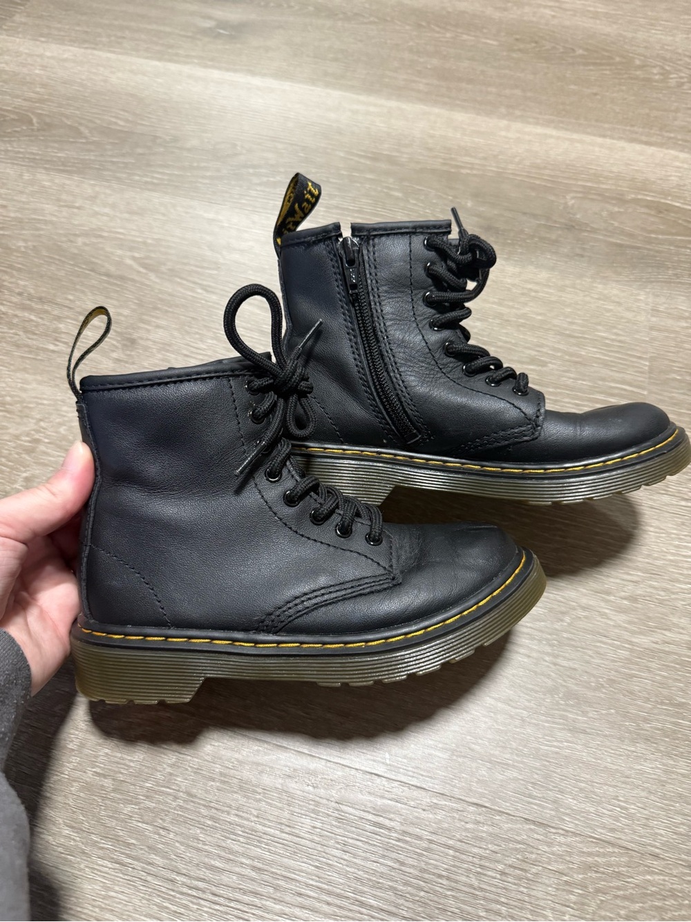 Kids Dr. Martens 1460 Junior boots featuring a distinct side zipper for easy on